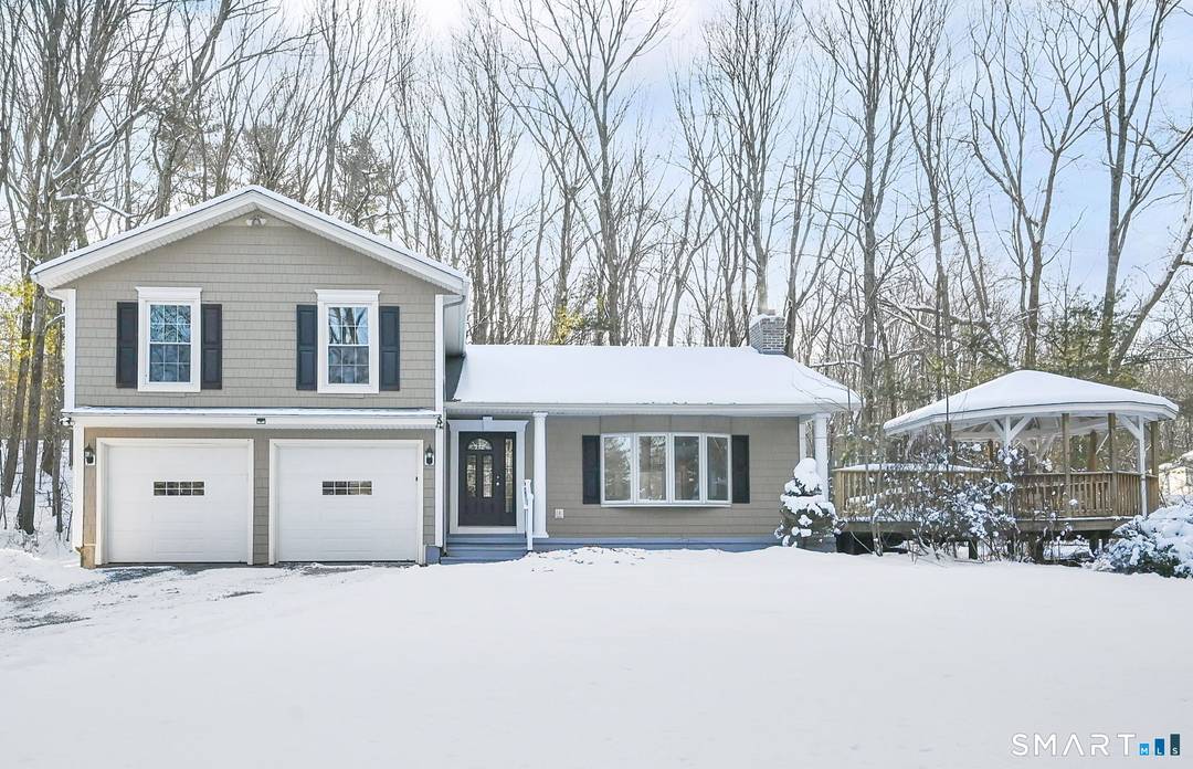 Welcome to this sun drenched split level retreat set on 2 private acres, tucked back from the road for exceptional peace and privacy.