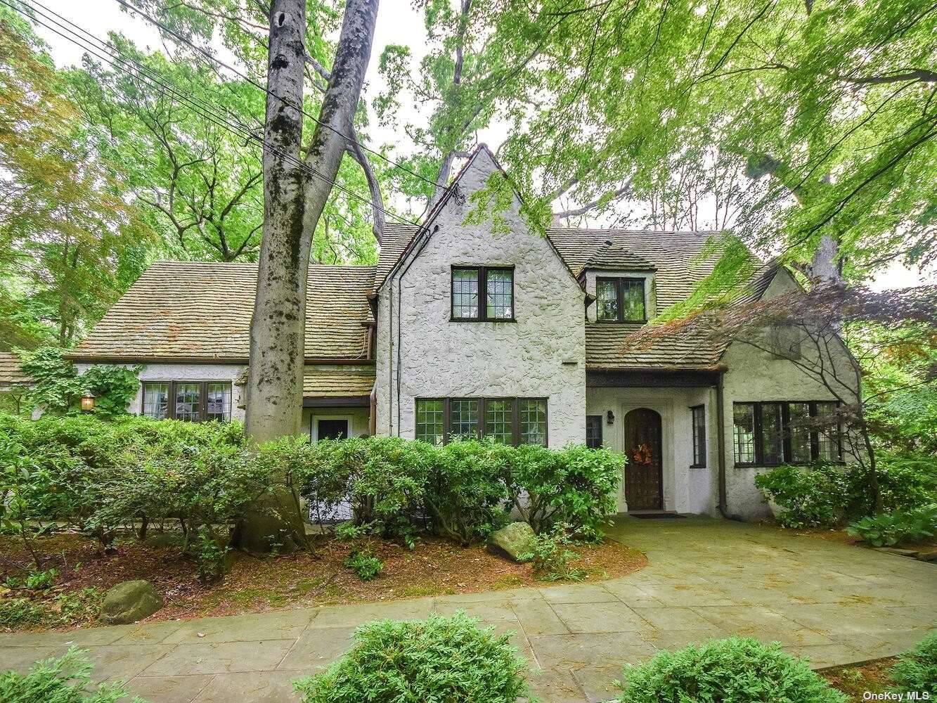 Ever so charming 4 BR Traditional English Tudor nestled on lush private 1 2 acre steps to beach amp ; schools.