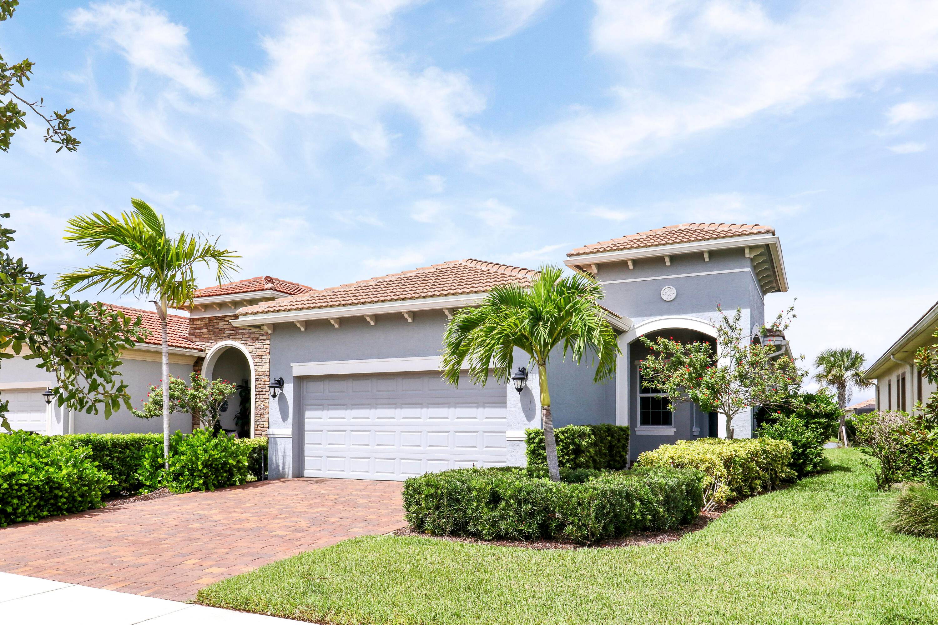 NESTLED ON A LAKEFRONT LOT and BRIMMING WITH UPGRADES, this 2BR Den 2BA 2CG home is sure to please !