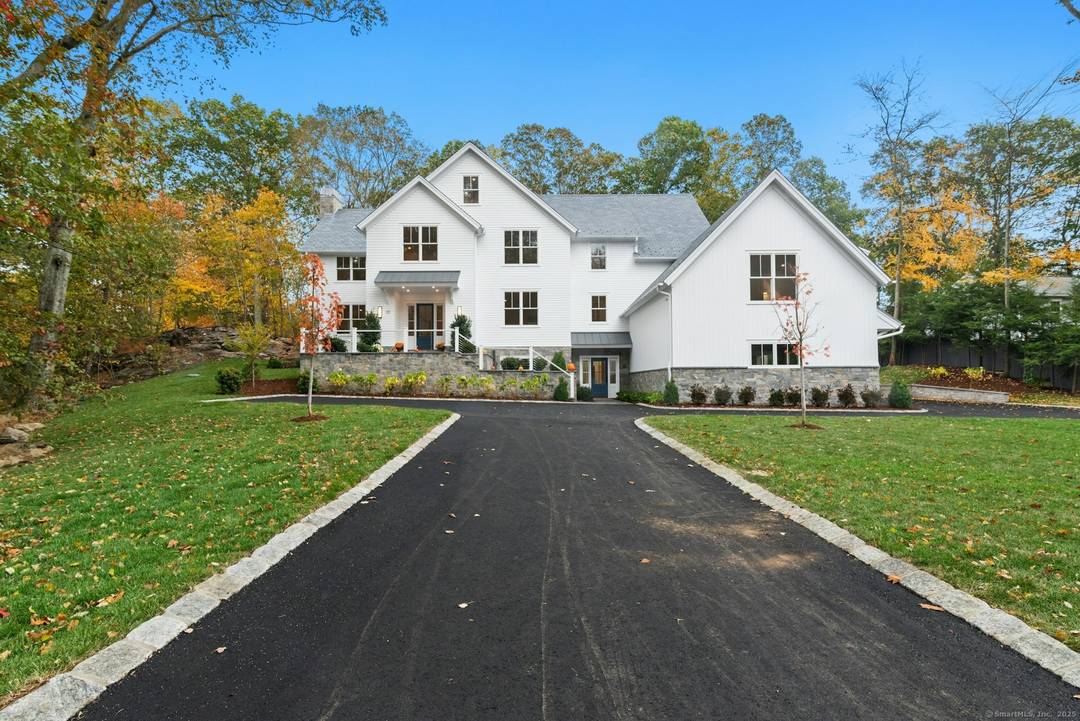 This exceptional Shingle Style Colonial blends form and function to inspire elegant everyday living.
