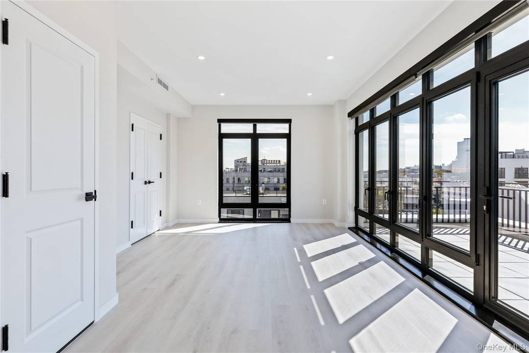 Penthouse 501 offers 846 square feet of thoughtfully designed one bedroom living including both a private balcony and terrace offering stunning Manhattan views.