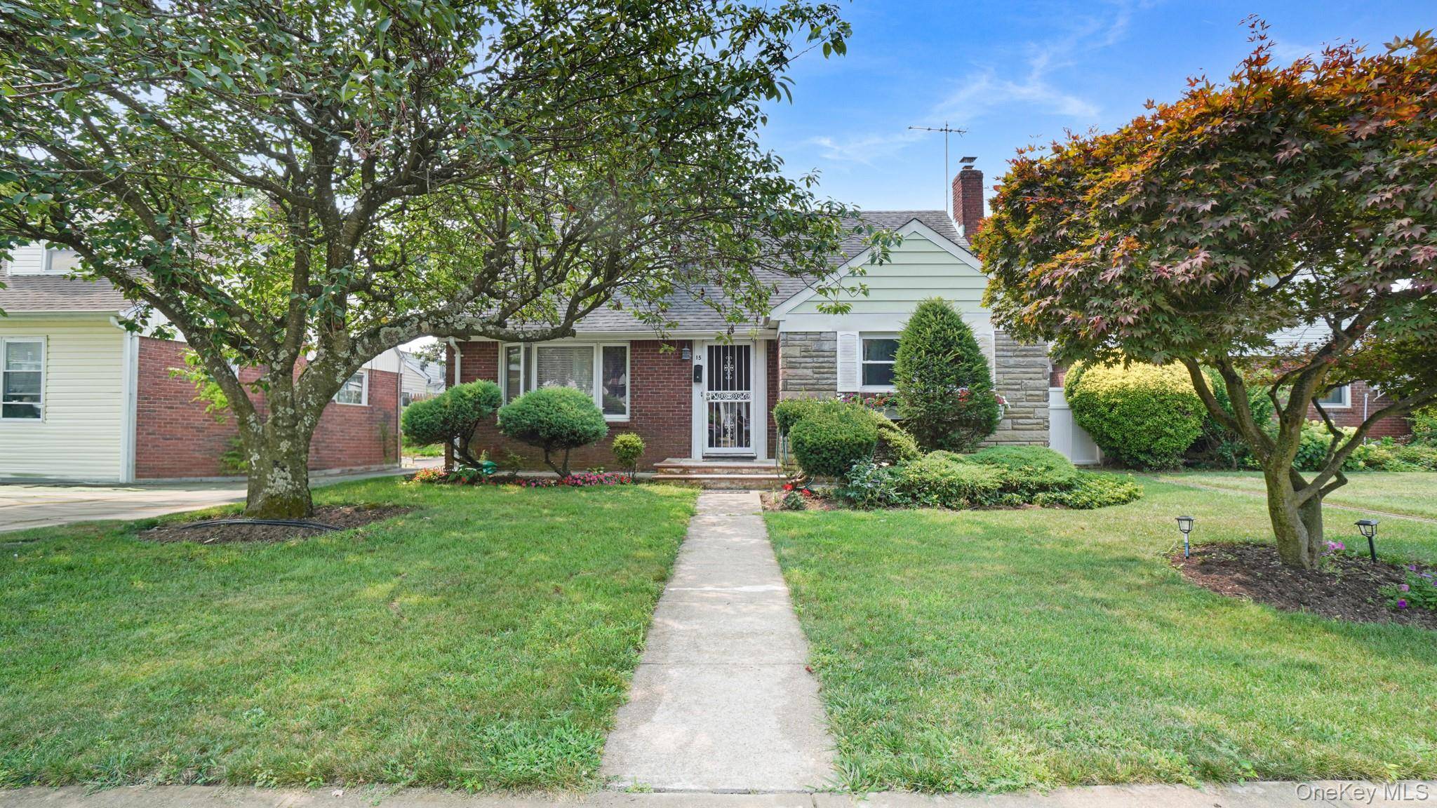 Welcome to 15 Koeppel Pl in Hempstead, a charming 4 bedroom, 2.