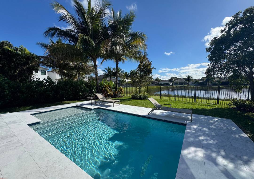 Upgraded Tahiti Expanded model on a premium lake lot in the sought after Lotus community.