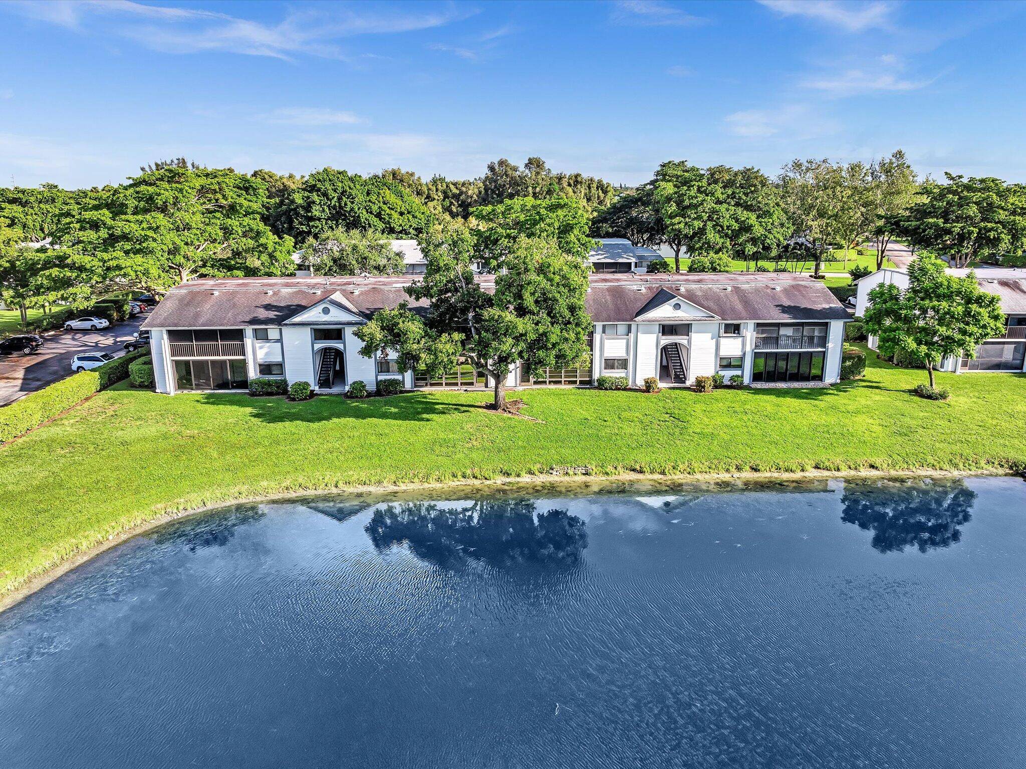 Discover luxury in this beautifully renovated corner unit located in the heart of Delray Beach's vibrant 55 community, and a short walk to the clubhouse.