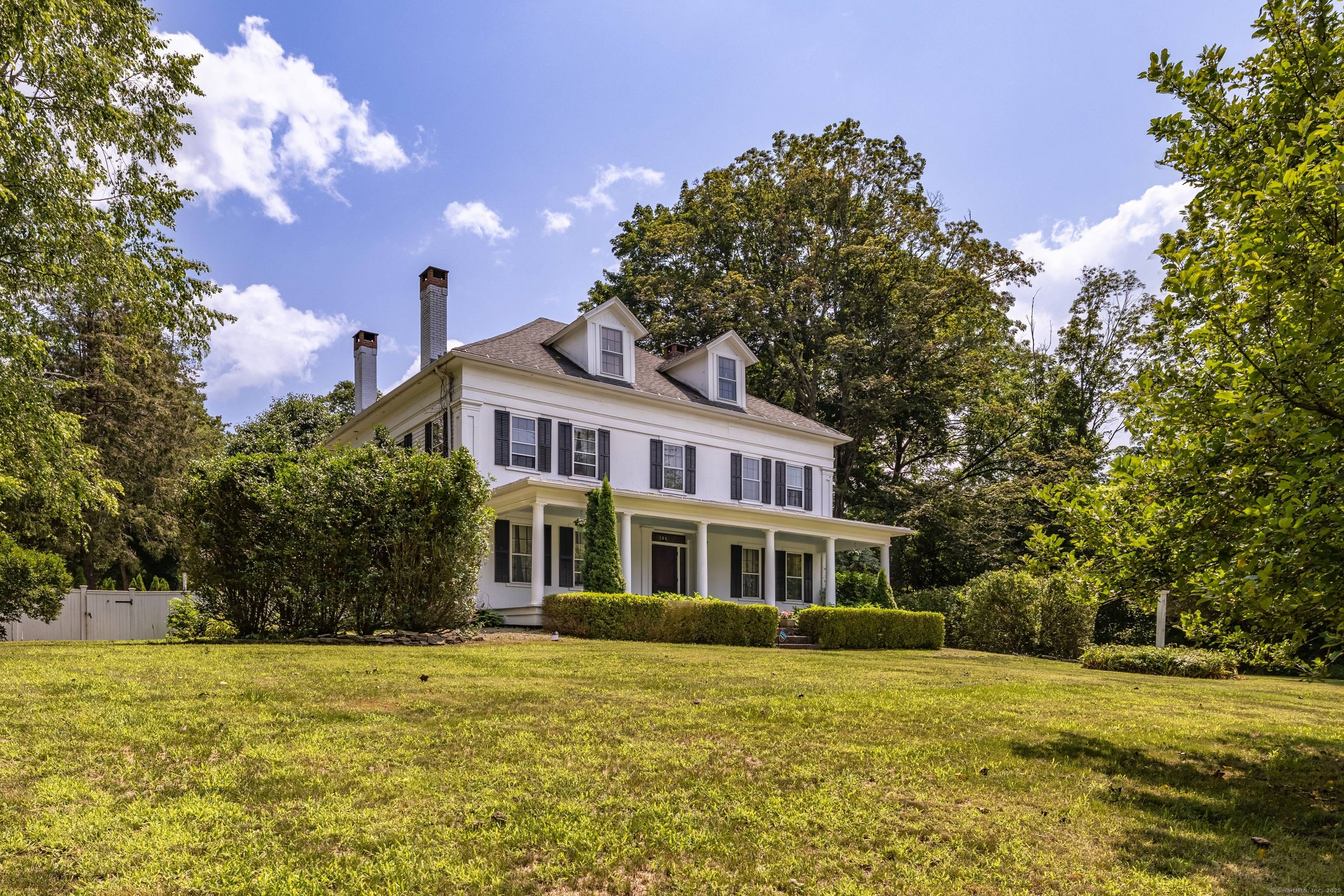 Elegant, Greek Revival Colonial home in historic Windham Center completely remodeled in 2005 by New England Design.
