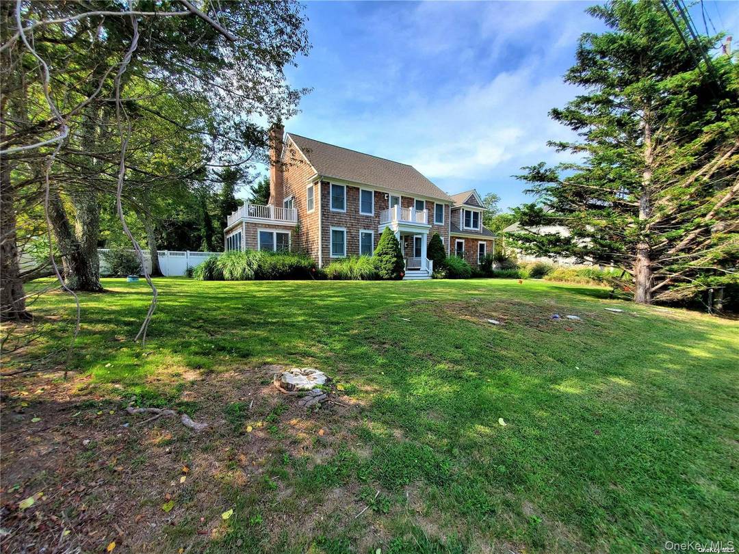 Beautiful like new colonial just 500 feet from sandy bay beach.