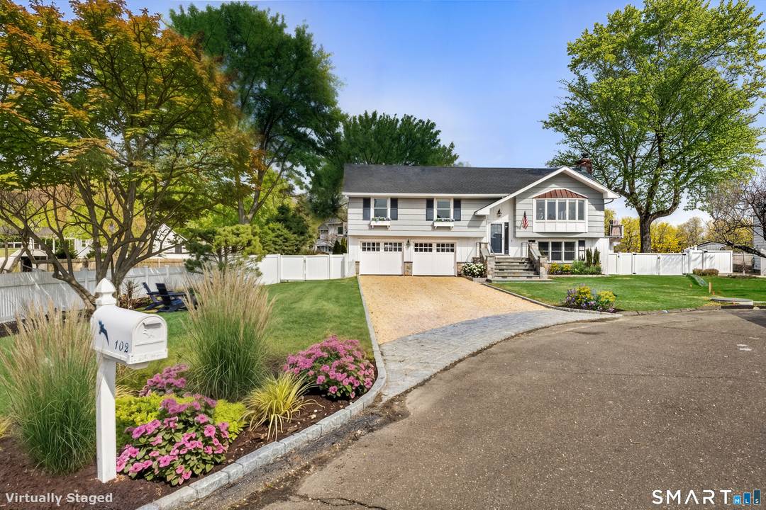 Experience coastal living at its most exceptional in this exquisitely renovated waterfront residence, ideally positioned on a quiet cul de sac in Stamford's coveted Cove seaside neighborhood.