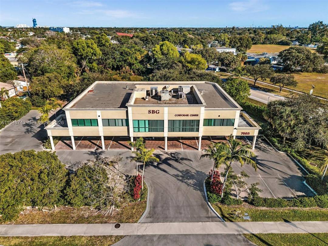 12, 297 SQFT Office building with adjacent vacant land for sale.