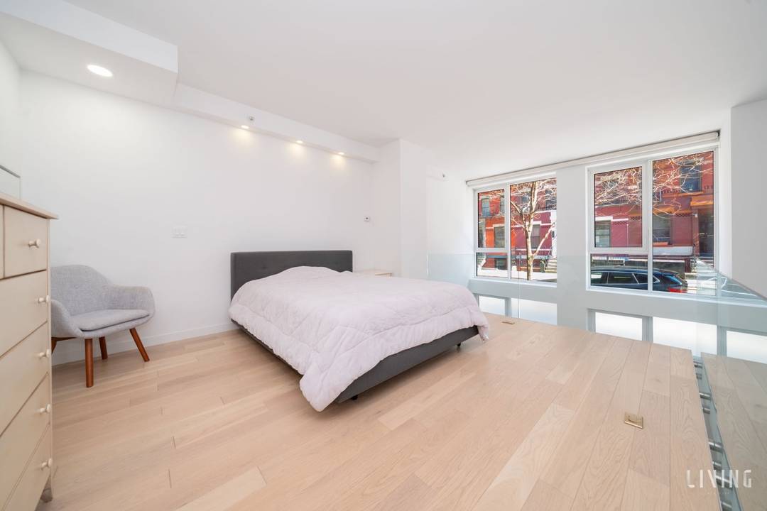 Experience dramatic loft style living in this stunning duplex one bedroom, two bathroom residence at 540 West 49th Street.