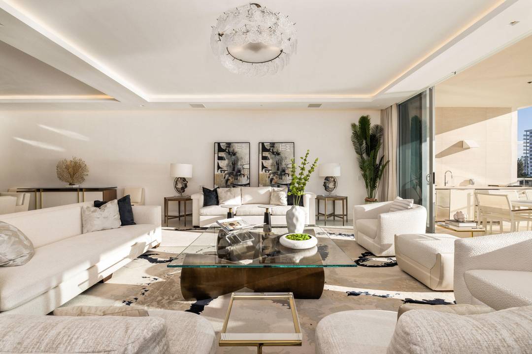 Penthouse 2 at Boca Beach Residences is a rare, fully furnished waterfront offering with sweeping views of Lake Boca and the Atlantic Ocean from every guest suite.