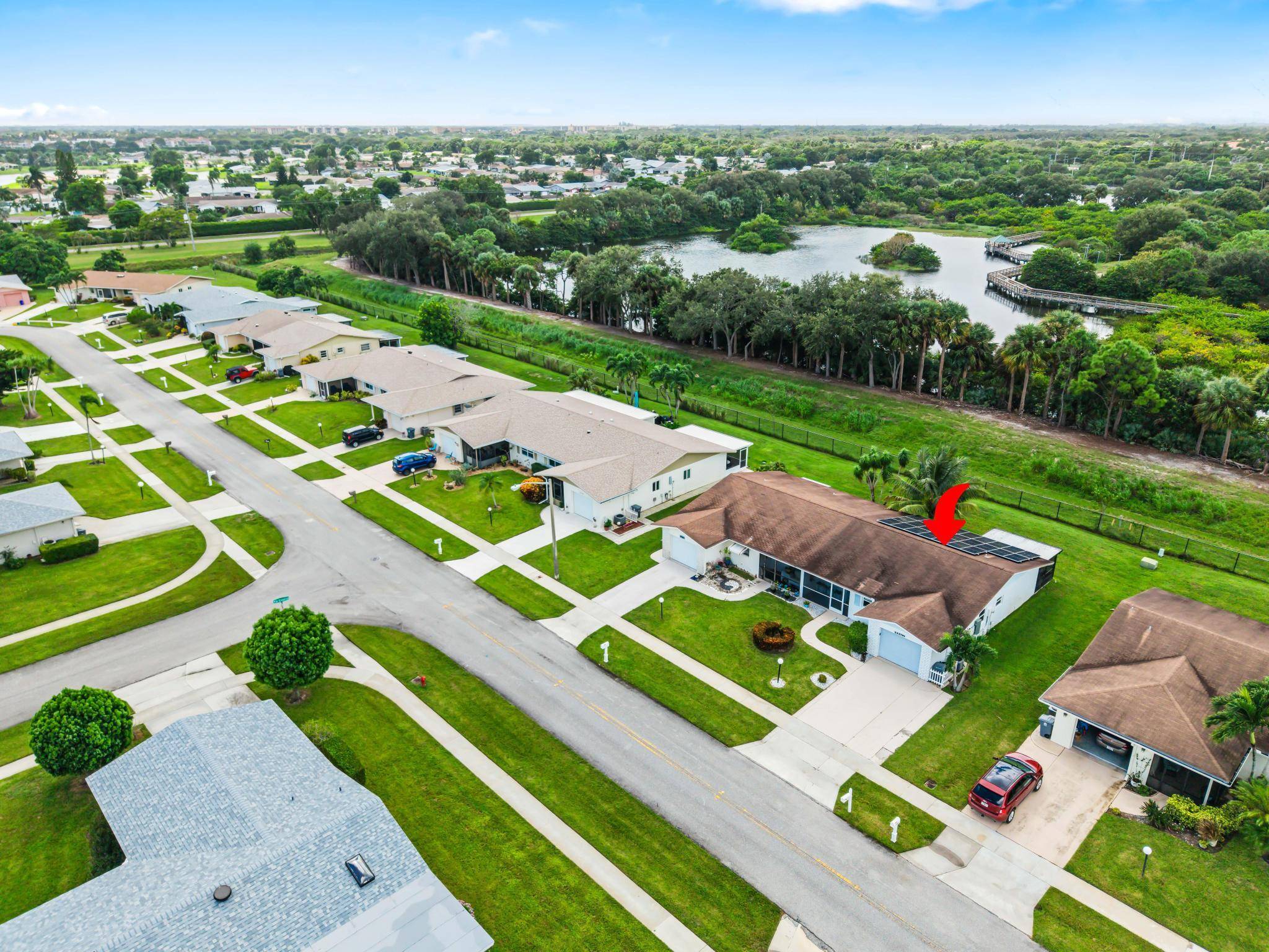 One story villa with garage plus solar panels for ultra low utility costs.