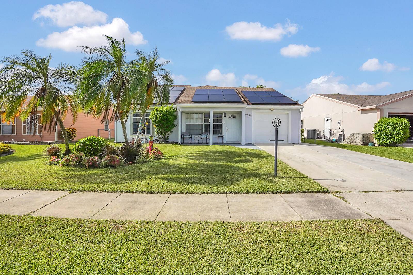 Experience the perfect blend of comfort and efficiency in this delightful single family home, nestled within the charming Countrywood community in Lake Worth, FL.