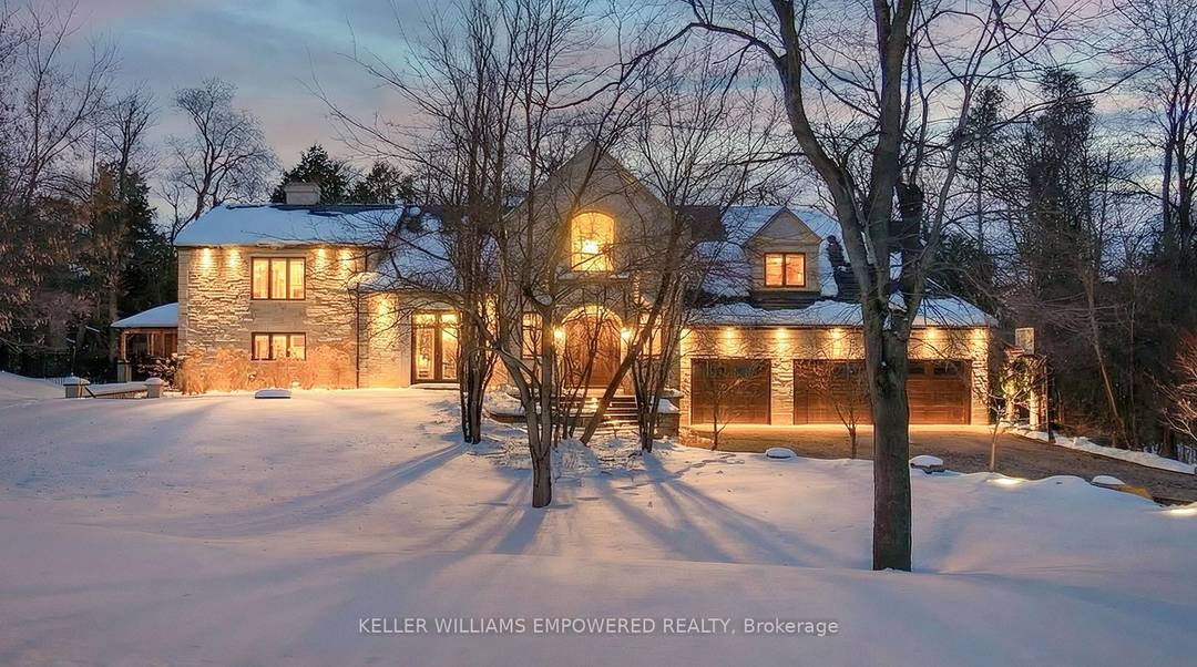 Set behind an automated custom wrought iron gate and framed by towering trees, this estate offers resort style outdoor living and exquisite interior finishes.