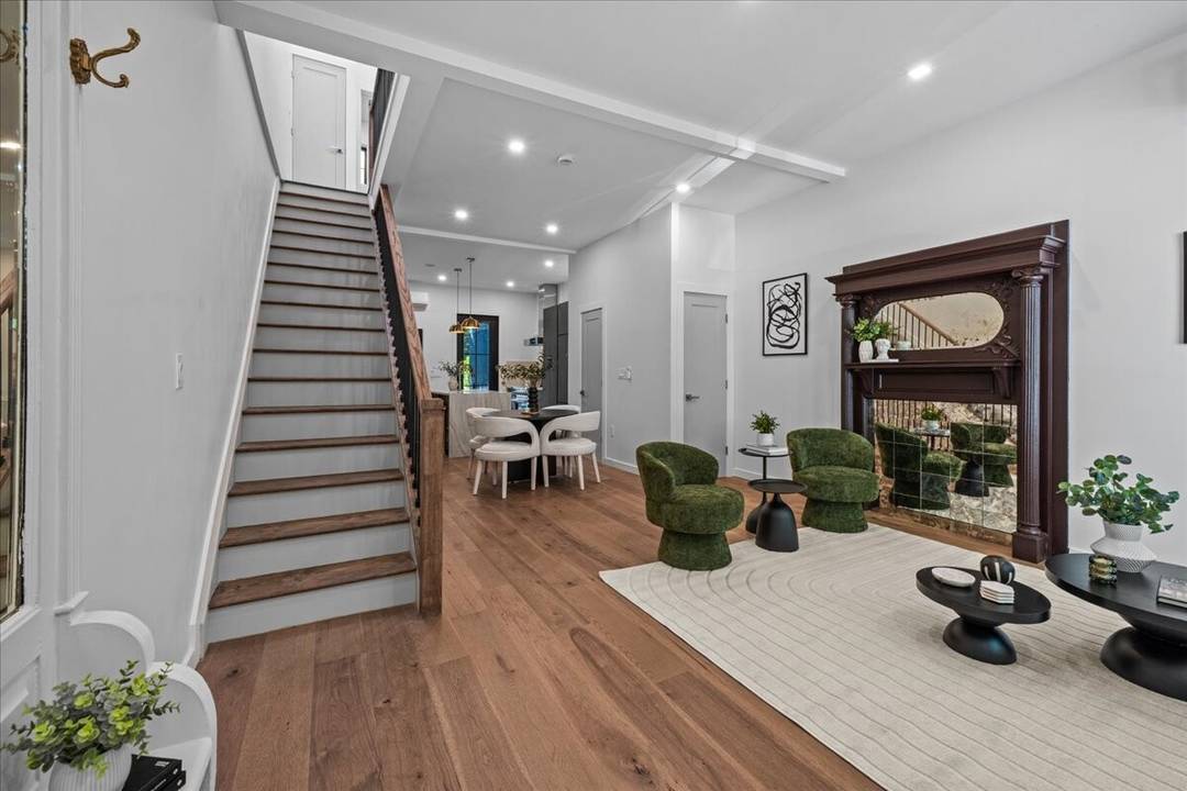 Welcome home to this masterfully gut renovated two family brick townhouse on one of Crown Heights' most beautiful landmarked blocks.
