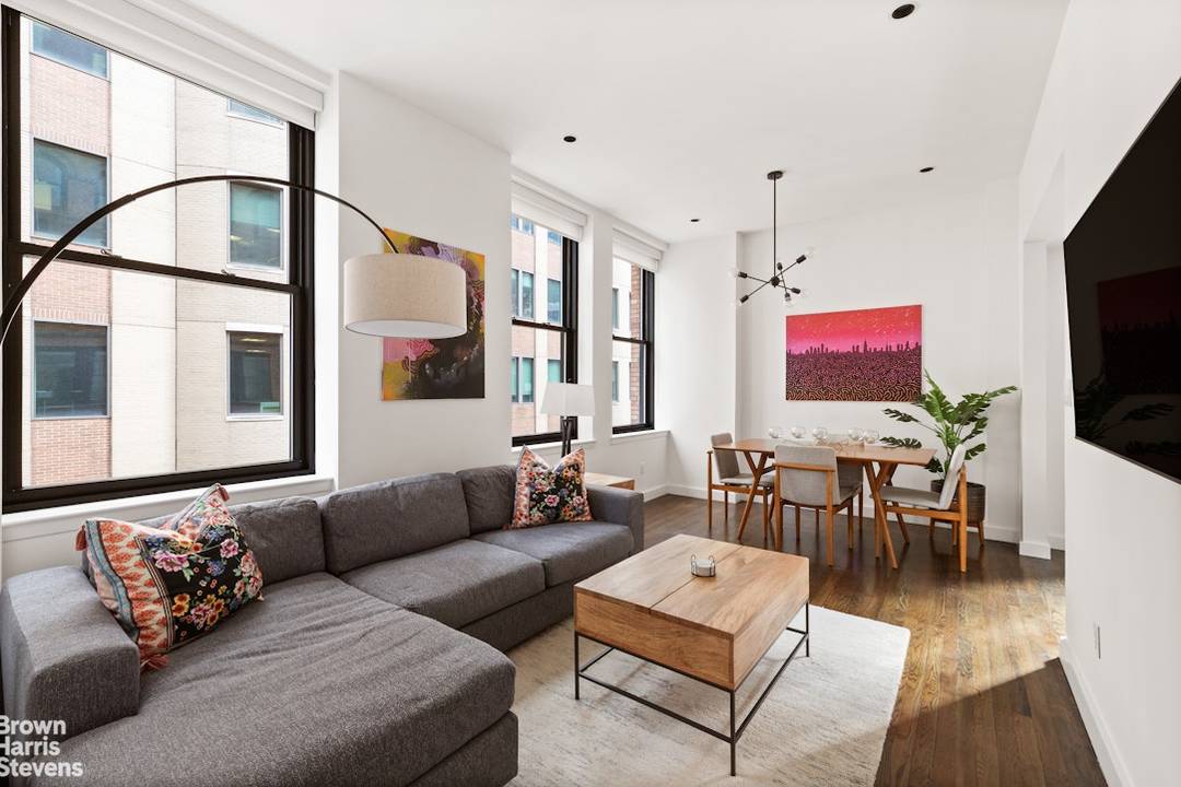 This apartment is available to be purchased entirely furnished The Apartment A bright downtown loft style one bedroom awaits you, where modern elegance meets comfort.