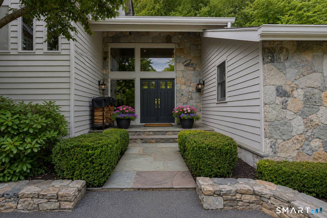 Nestled on a beautifully landscaped private lot in West Mountain Estates surrounded by nature, this exceptional 4 bedroom, 2.