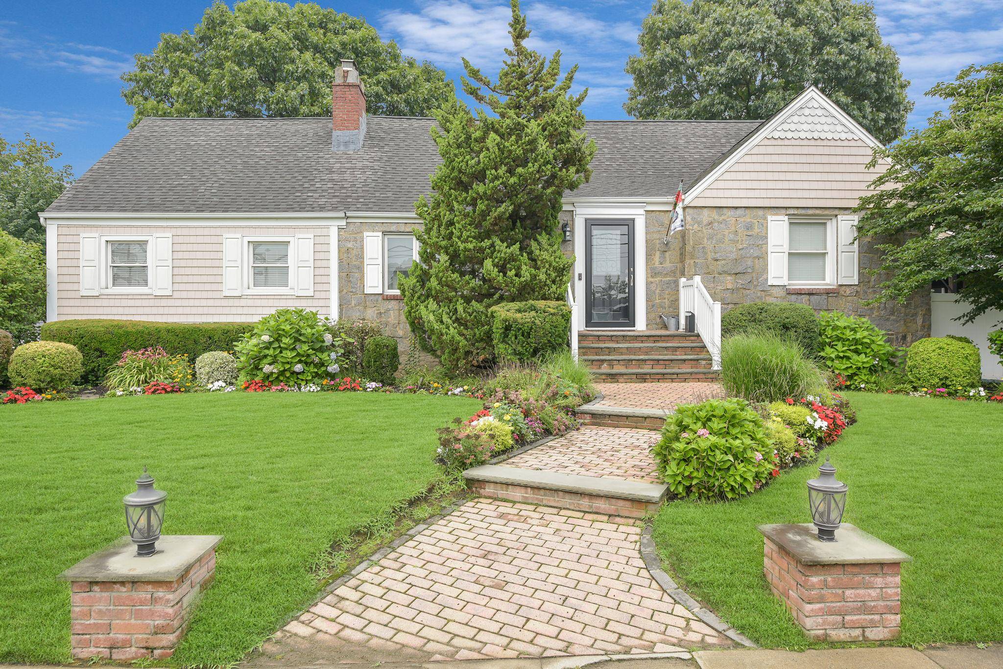 We bring you this exceptional 4 bedroom 4 full bathroom expanded cape in the desirable heart of Oceanside.