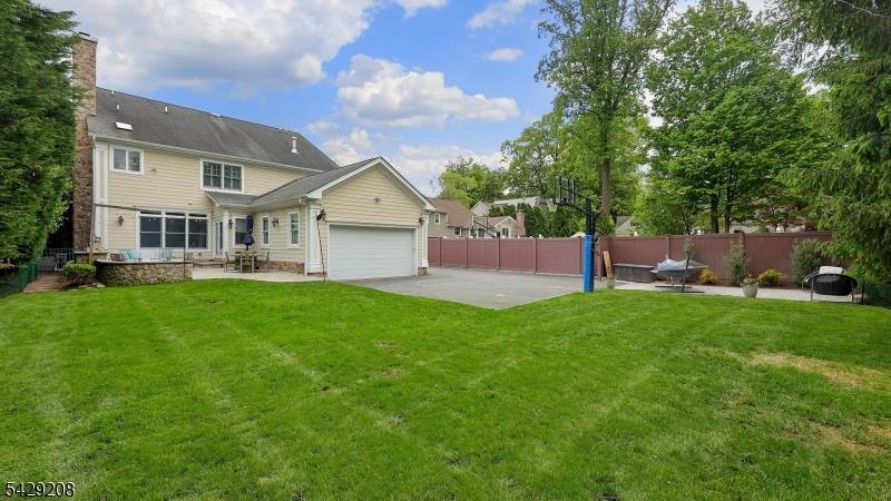 Welcome to this expansive 5 bedroom, 5 bath Colonial that blends timeless charm with modern luxury.