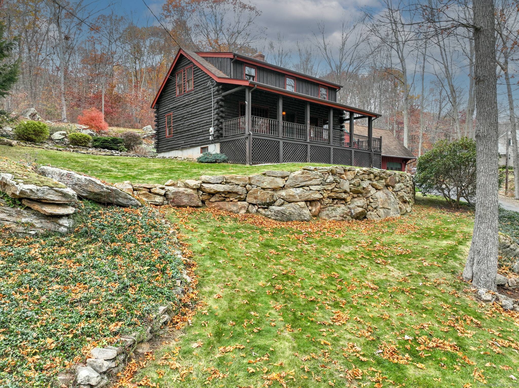 This charming center chimney Log Cape will warm your heart with rustic appeal and the smell of pine !