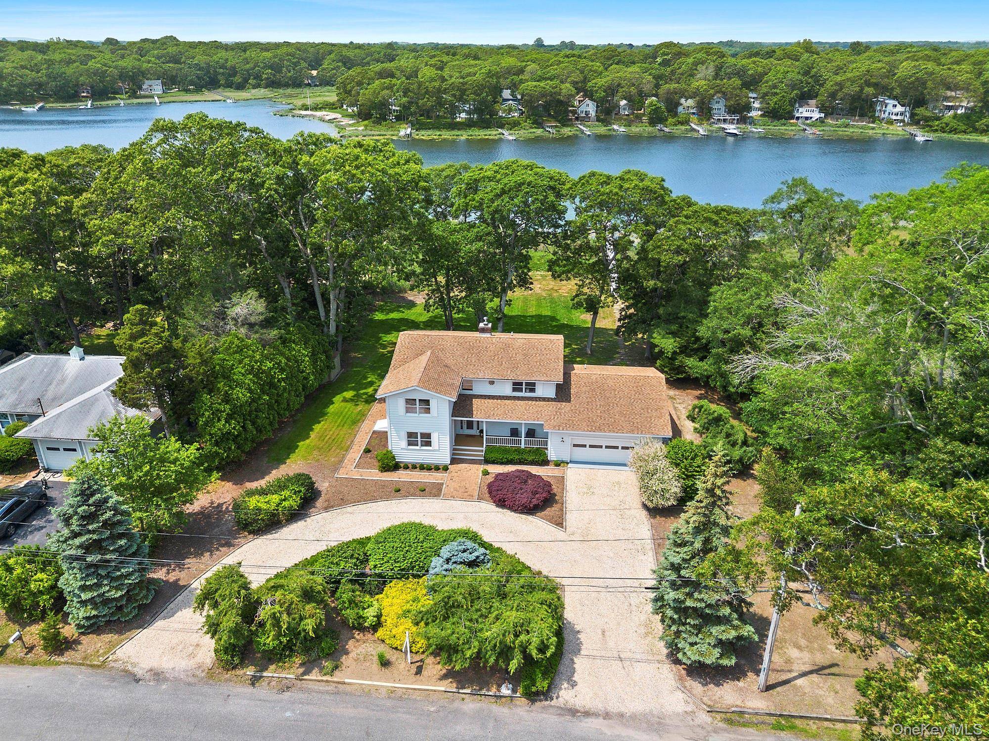 Experience iconic North Fork waterfront living at this exquisite retreat located in the heart of Cutchogue.