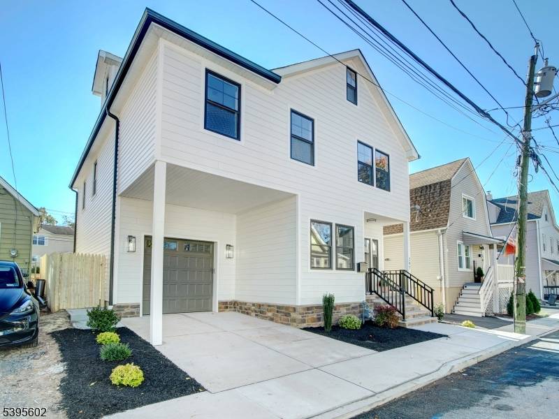 Welcome to 297 Oswald, a masterfully built new construction home in Union offering an incredible 3, 877 sq.