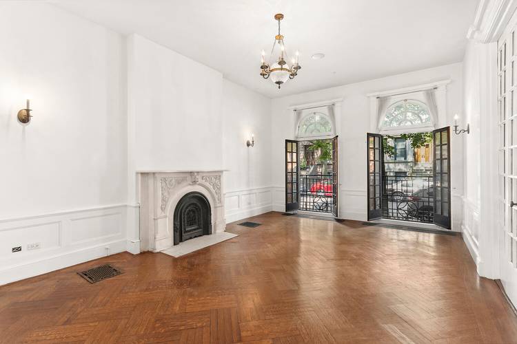 Welcome home to this stunning six bedroom, five and a half bath townhouse tucked along a picturesque, tree lined block in Hamilton Heights.