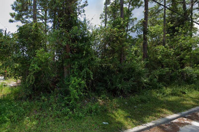 Great opportunity to build your dream home on a beautiful corner lot in quaint neighborhood of Vero Beach !
