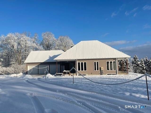 Tucked away on over 6 private acres in Durham, this extraordinary dream home is ready for your finishing touches.