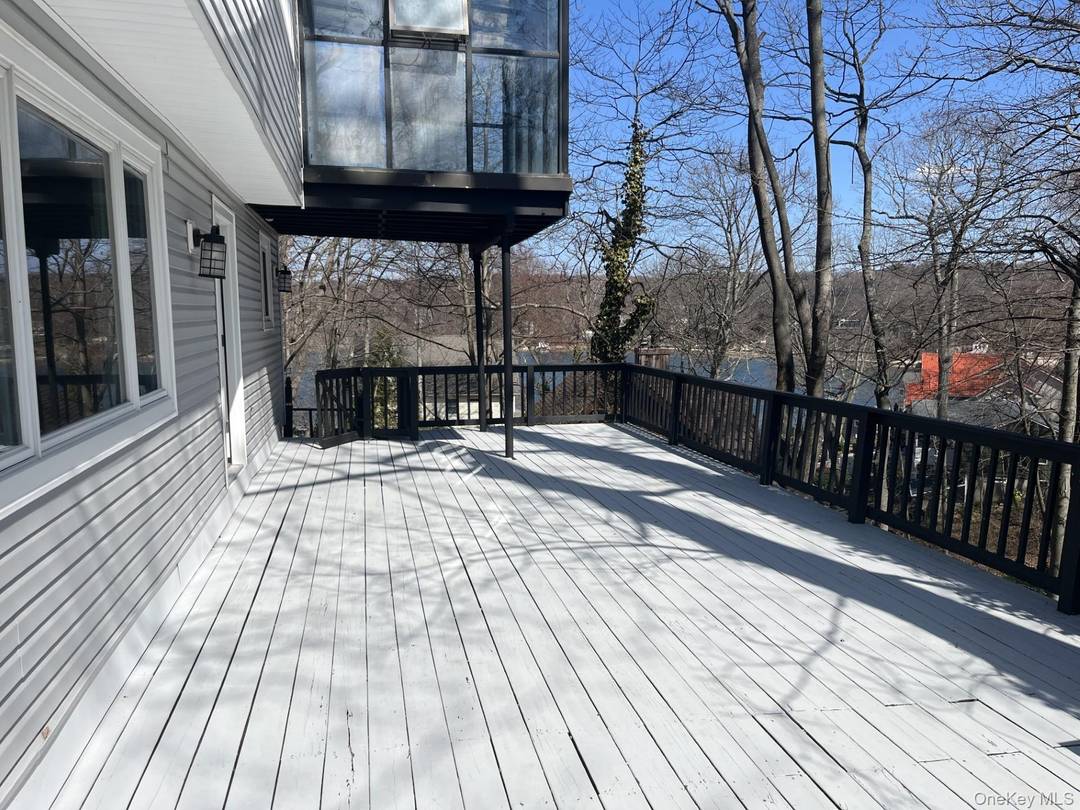 Luxurious coastal living in this gut renovated 5 bed, 3 bath hi ranch with year round water views !