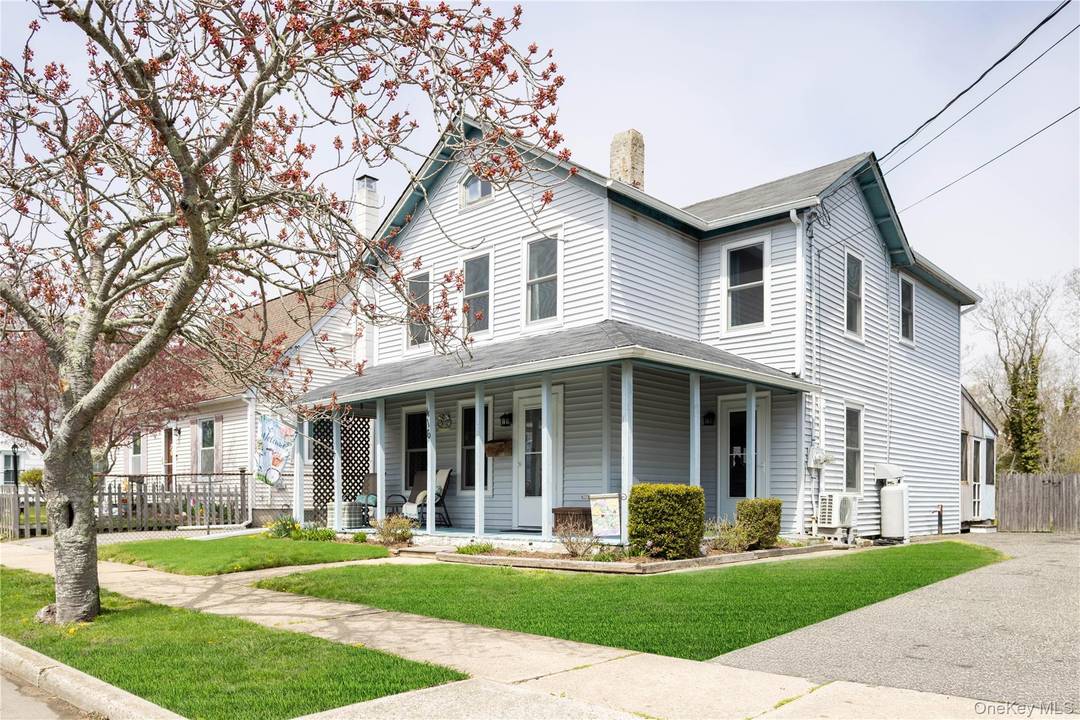 Nestled on a generous lot in the heart of Greenport Village, this charming farmhouse offers the perfect blend of character, convenience, and potential.