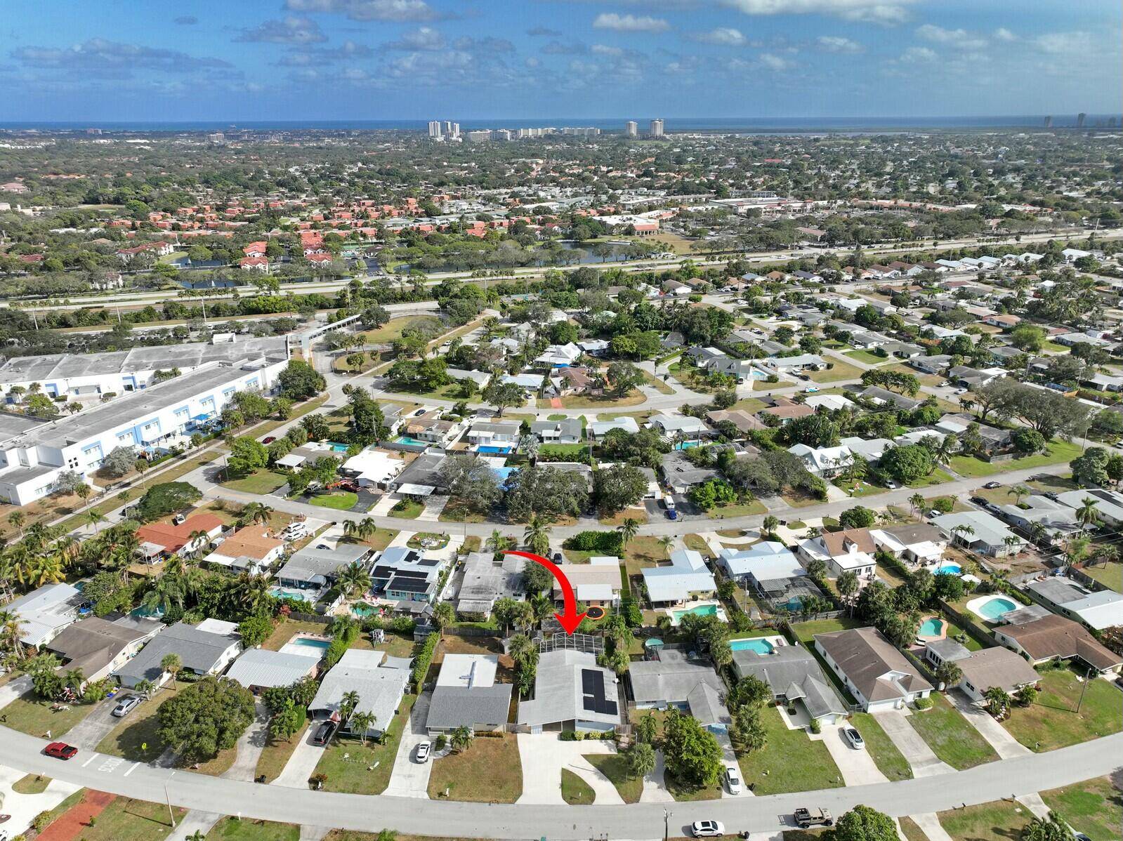 This beautifully upgraded vaulted ceiling mid century single family home in Palm Beach Gardens features 3 bedrooms and 2 bathrooms, with no HOA fees.