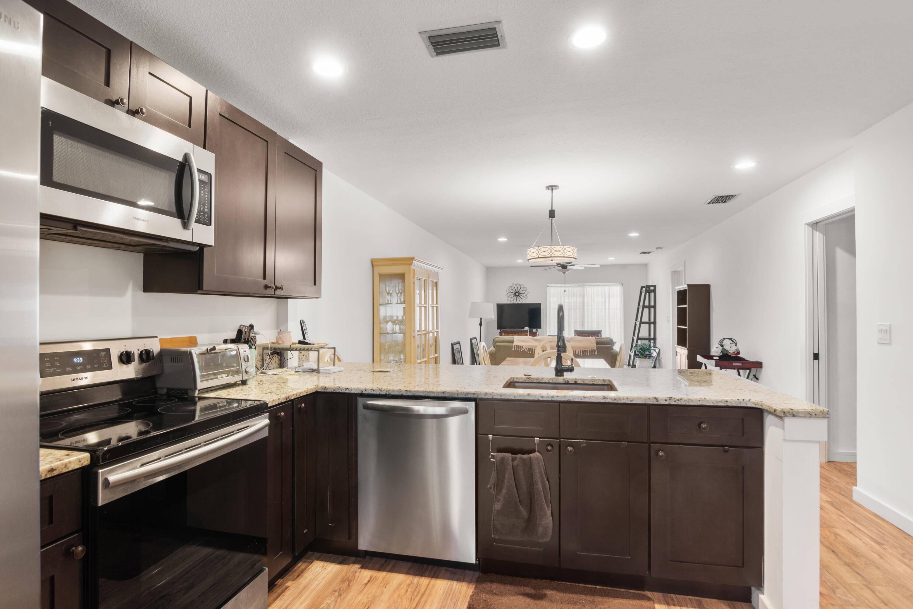 Discover this beautifully updated 2 bedroom, 2 bath villa style condo in the sought after Grove Condominium, a vibrant 55 gated community in Fort Pierce.