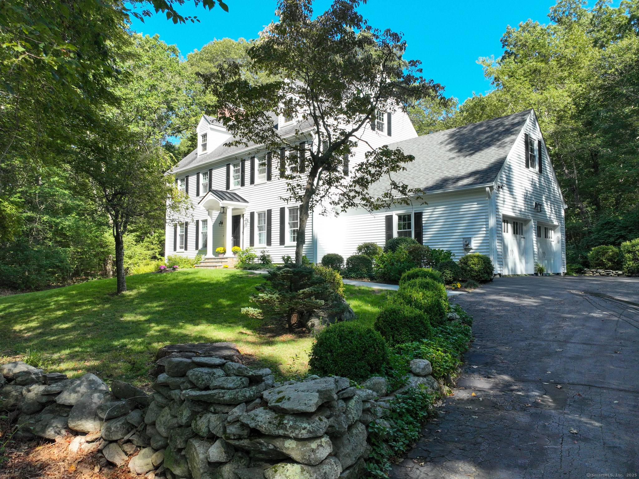 Classic New England Colonial set high on a private cul de sac, this 4 bedroom, 2.
