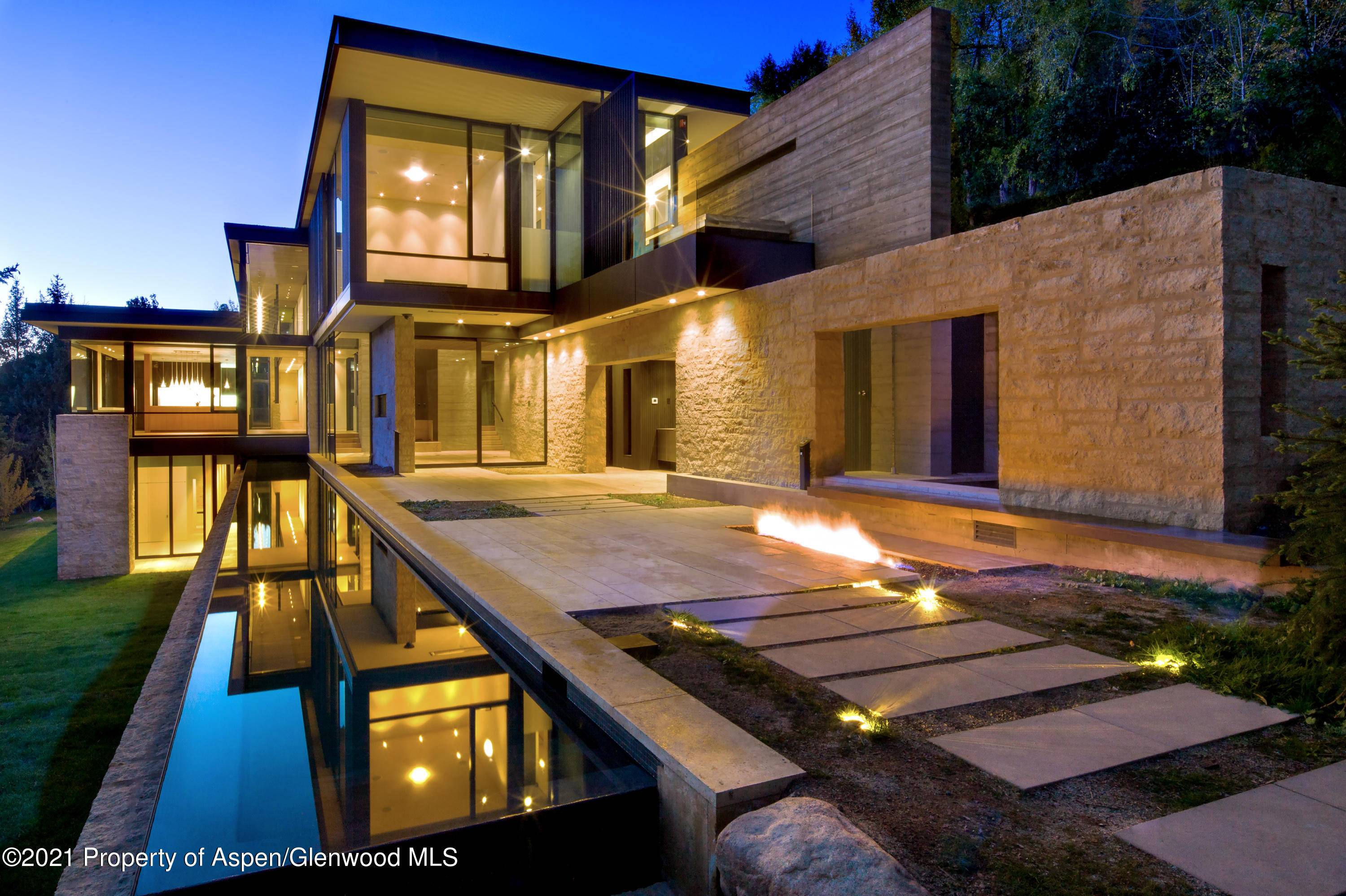 Nestled into the hillside, this elegant 9, 641 square foot home boasts dramatic views of Aspen Mountain and the surrounding peaks.