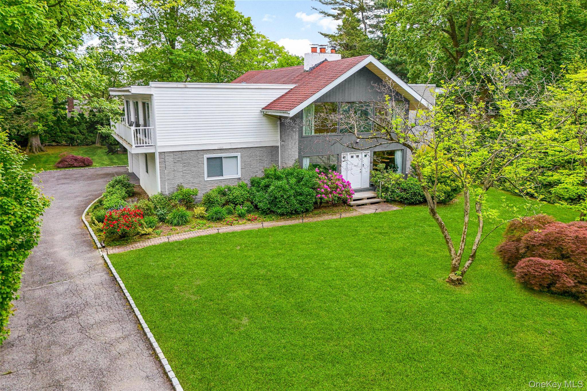 This stunning Mid Century Modern residence is ideally situated on one of the most prestigious and picturesque streets in the New Rochelle Scarsdale Post Office Estate area.