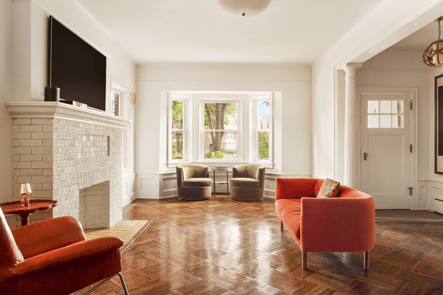 This semi detached four story brick townhouse with a private driveway and garage stands as a testament to thoughtful preservation and contemporary sophistication.