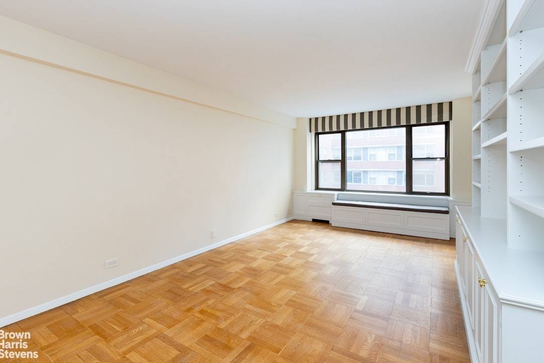 Very gracious one bedroom with large living room complete with custom bookcases, and separate dining room easily made into a small bedroom or office.