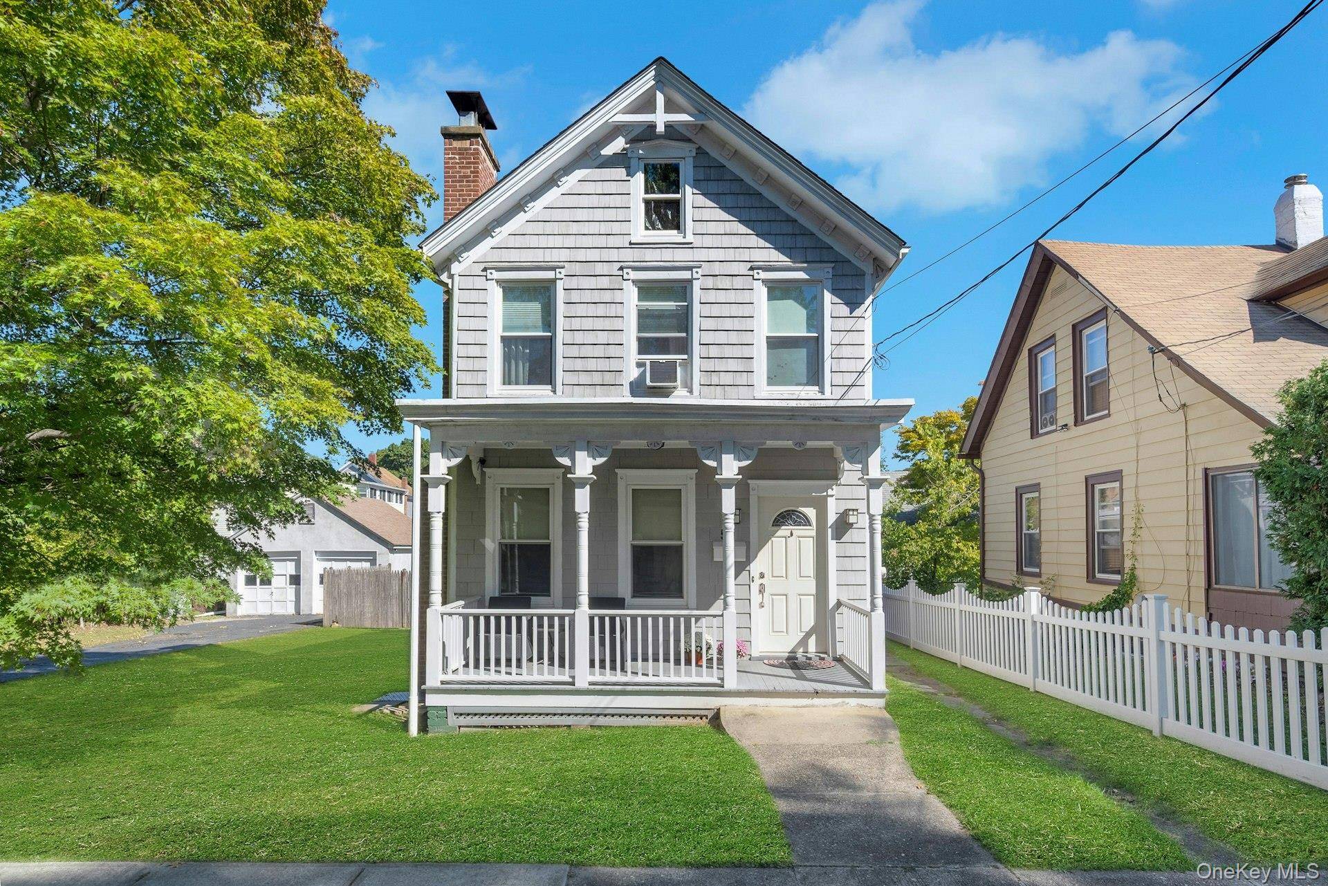 Imagine the lifestyle you can create in this appealing Victorian, where a welcoming rocking chair front porch sets the tone and modern updates enhance timeless charm.