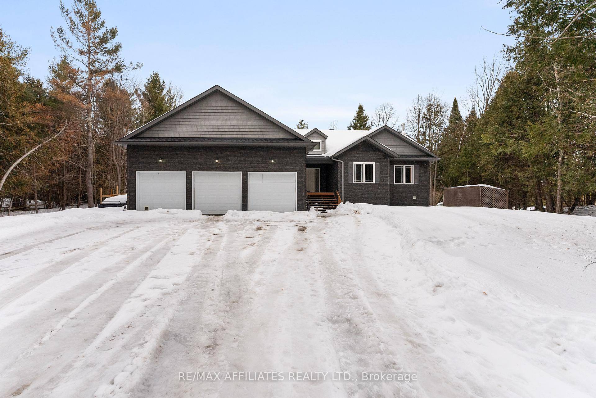 Tucked away on a lush 5 acre treed lot, this exquisite bungalow offers the ultimate blend of tranquility, privacy, and modern comfort.