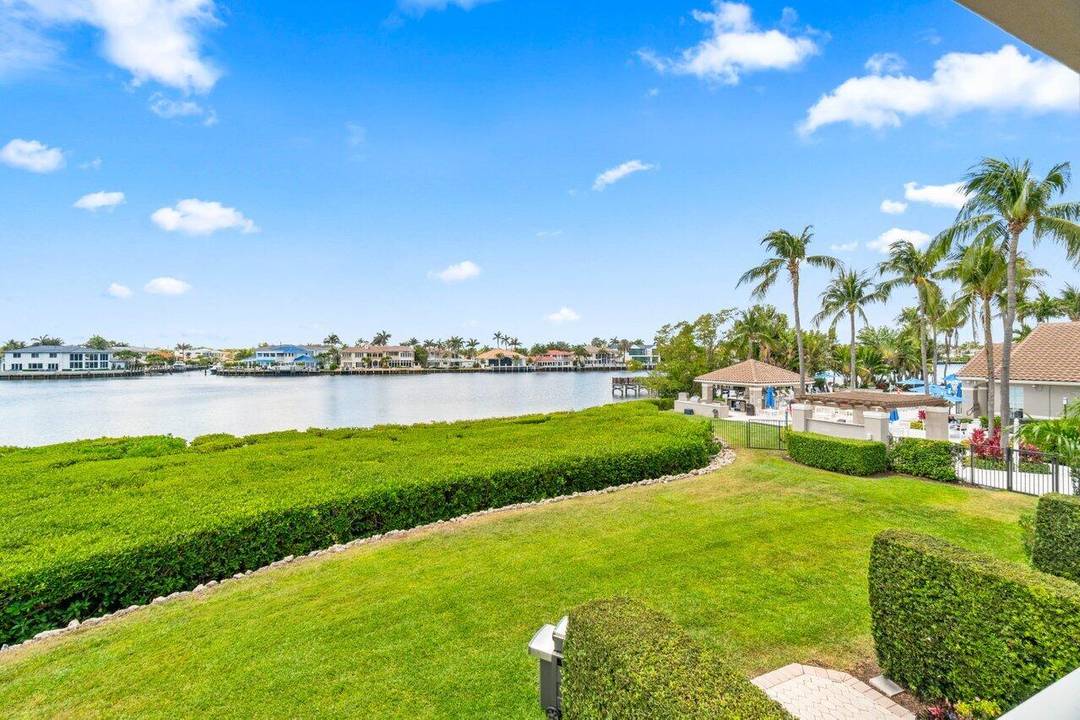 Wake up to Intracoastal views and walk to your private beach from this beautifully renovated 3BR 3BA waterfront townhome in the coveted Highland Beach Club.