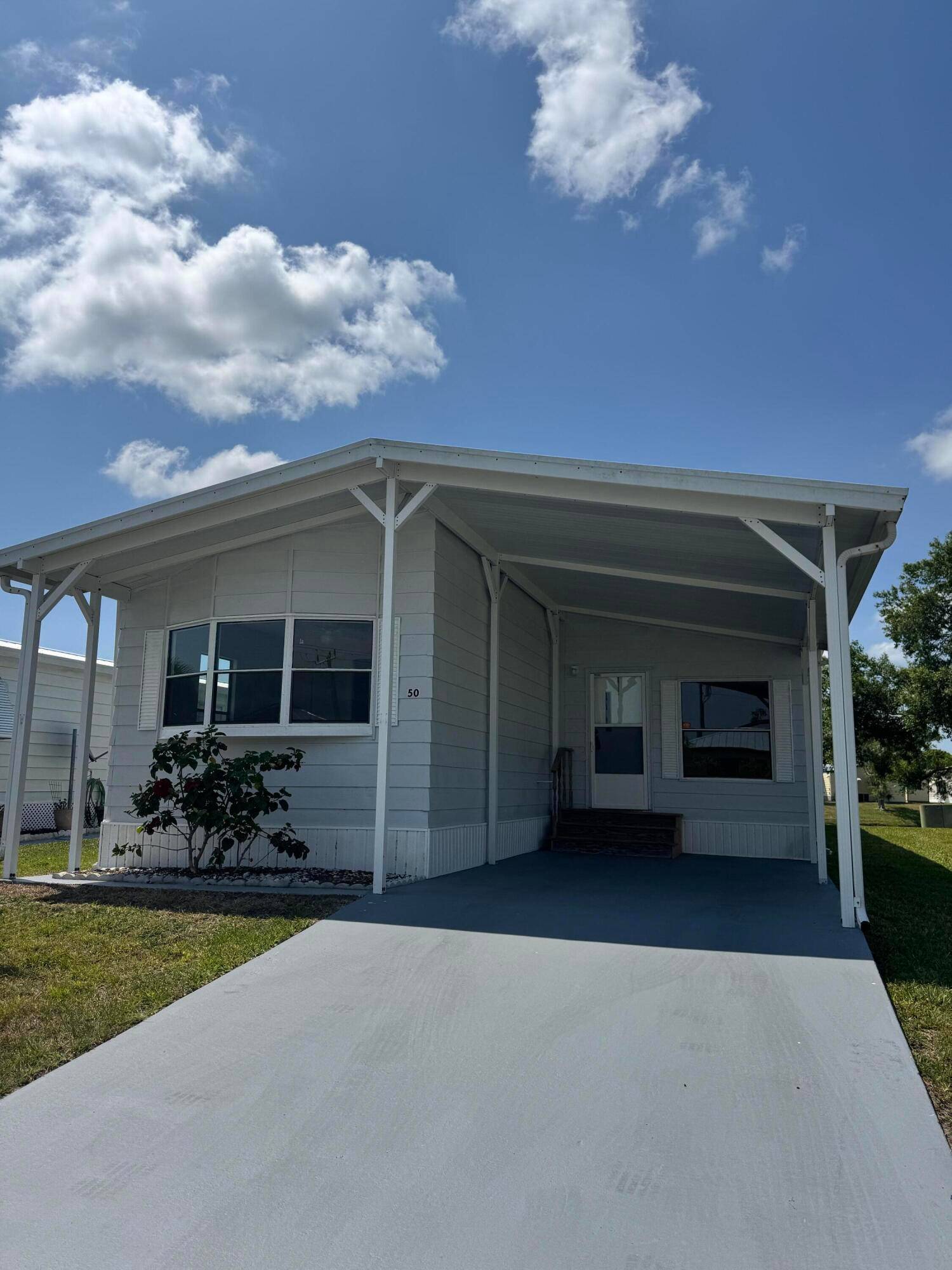 2 bedroom 2 bath lake view home in the desirable 55 Spanish Lakes community.