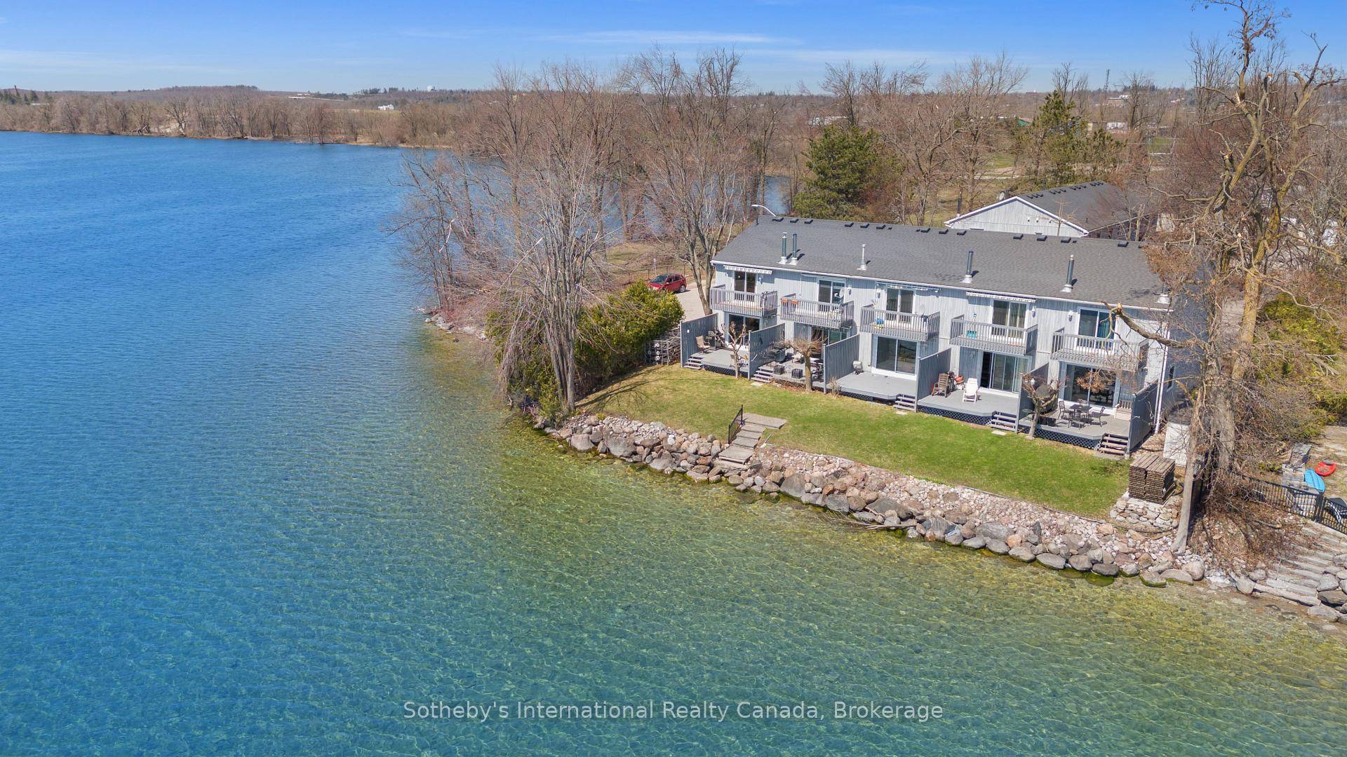 Discover this beautifully maintained end unit waterfront townhouse condo an ideal home for professionals, couples, downsizers, or anyone craving an effortless lifestyle by the lake.