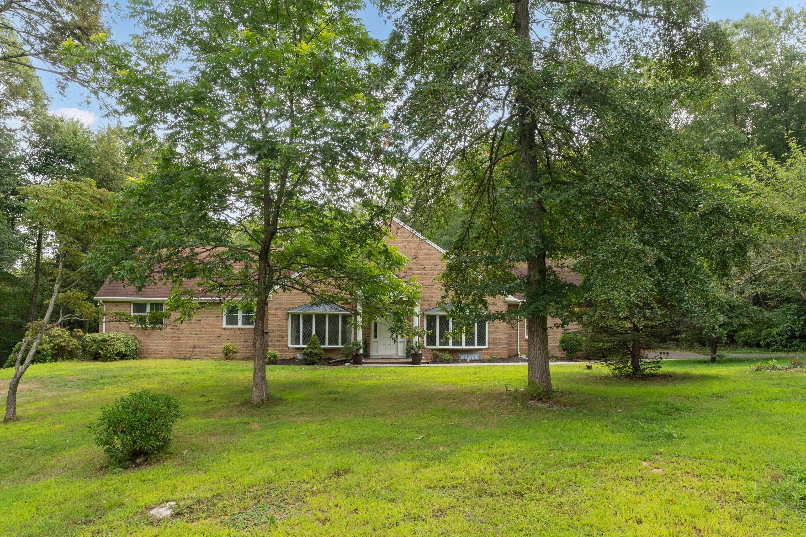 This custom built, large brick ranch home offers over 2, 700 square feet of living space and has potential for expansion on both the upper and lower levels.