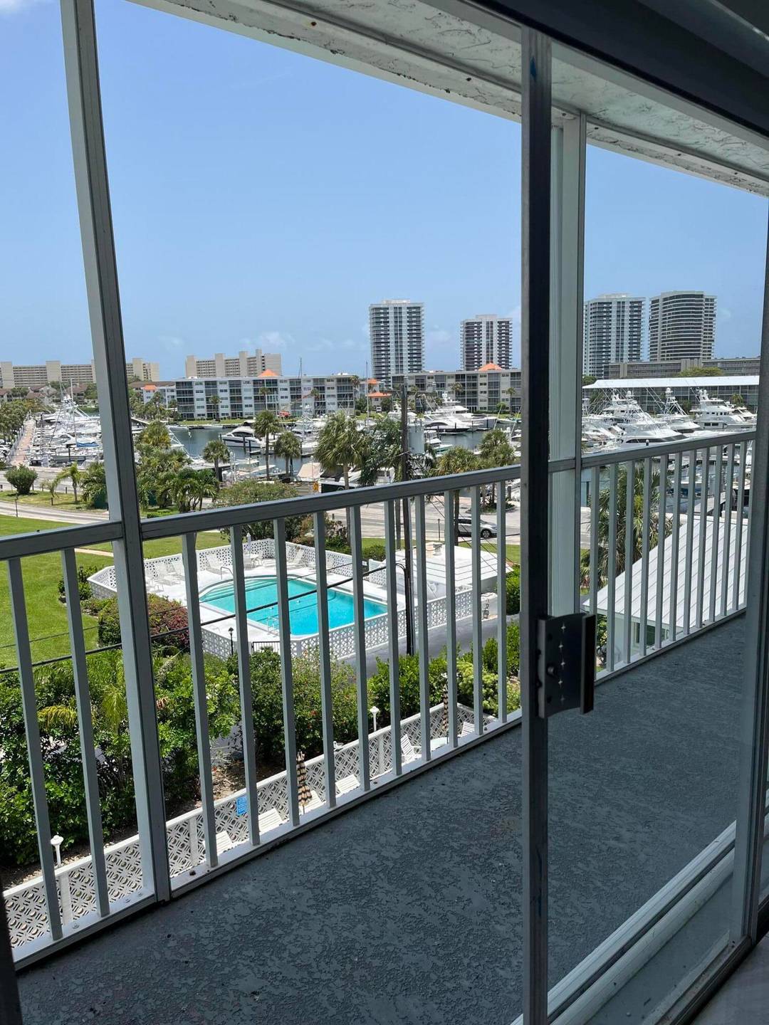 Extra Large 3 bed 3 bath 4th Floor Corner Double Unit elevator and stair access Beautiful Panoramic Marina and Pool Views.
