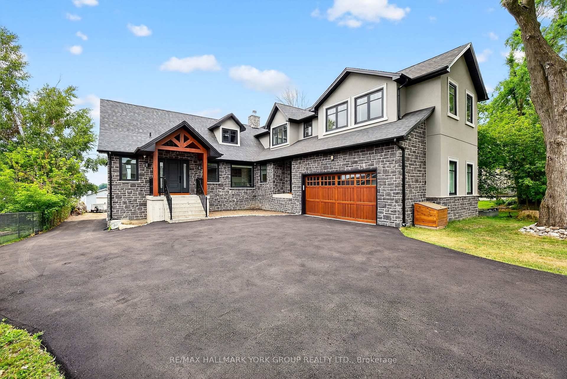 Beautifully Designed Custom Built Lakefront Cottage With Stunning Views !