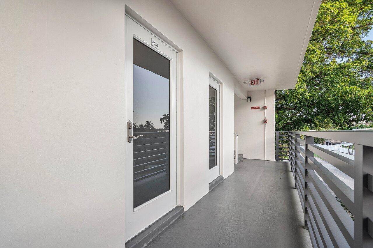 Experience the best of coastal Florida living in this light filled end unit gem nestled in the sought after Tropic Harbor 55 community.