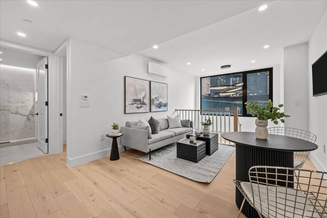 Residence GA at 107 Schaefer Street is a beautifully designed ground level duplex offering a unique blend of luxury, flexibility, and modern comfort amp ; parking in the heart of ...