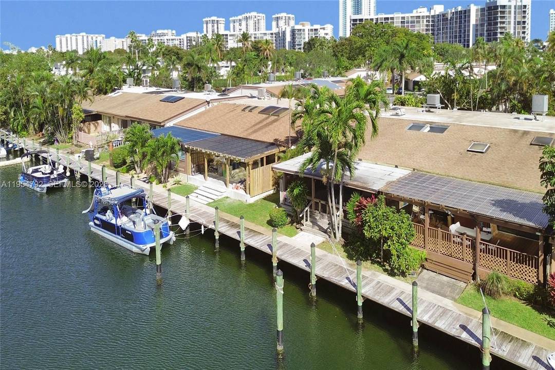 Truly one of a kind and rarely available, this remodeled 3 bedroom waterfront corner home in the coveted Harbourwood enclave of Three Islands offers a unique coastal lifestyle with 33 ...