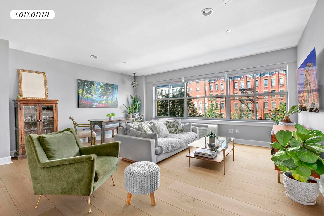 Enjoy the best of Harlem in this bright and spacious two bedroom, two bathroom home with magnificent views of historic brick townhouses and a tree lined boulevard.