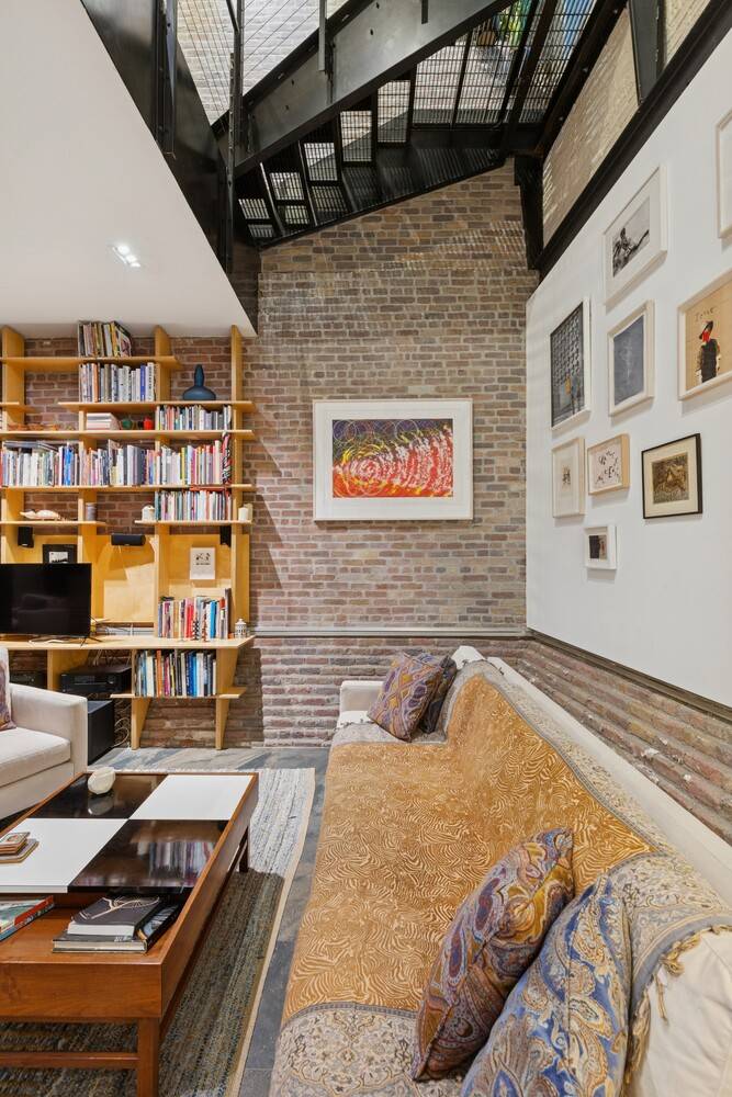 A rare architectural triplex inside the landmarked Eagle Warehouse, this three level home merges 19th century character with refined modern craft.